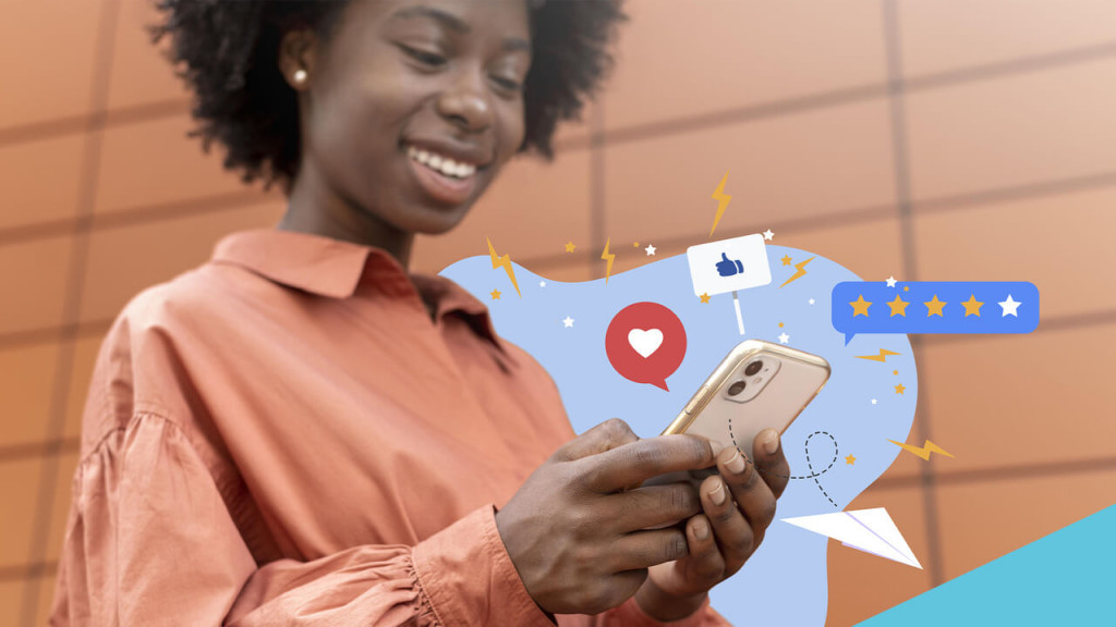 Na imagem, uma mulher negra utiliza o smartphone para troca de mensagens em redes sociais
